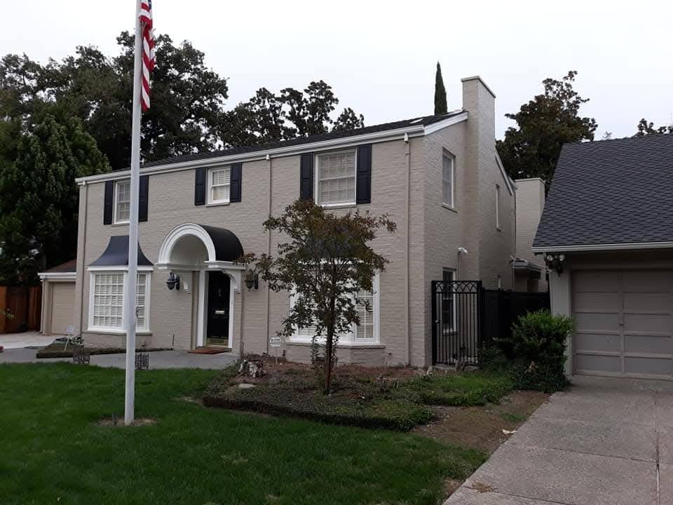 Exterior - Full two-story residential exterior painting (white with black trim)