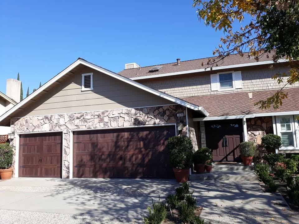 Exterior - Modern house facade with stone accents and brown garage door
