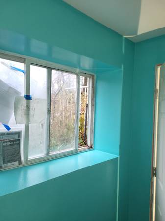 Interior - Detail-oriented window trim and turquoise accent wall