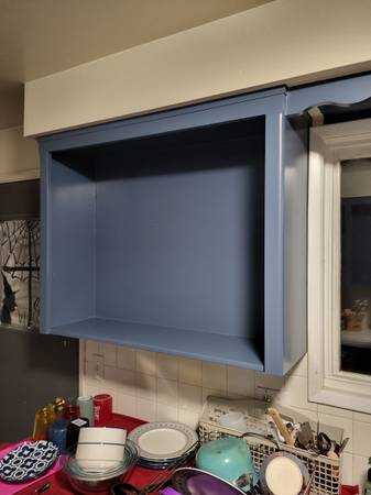 Interior - Custom blue-grey painted cabinetry/shelving